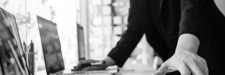Working process startup. Businessman working at the wood table with new finance project. Modern notebook on table. Pen holding hand